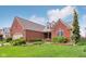 Beautiful brick home with lush landscaping, well-manicured lawn, and inviting curb appeal at 1361 Trescott Dr, Westfield, IN 46074