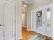 Inviting foyer with hardwood floors and decorative glass door, offering a warm welcome at 1361 Trescott Dr, Westfield, IN 46074