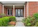 Charming brick home featuring a decorative glass front door and well-maintained landscaping at 1361 Trescott Dr, Westfield, IN 46074