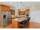 Updated kitchen features an island, granite counters, and stainless steel appliances at 1361 Trescott Dr, Westfield, IN 46074