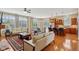 Bright open-concept living area boasts hardwood floors, neutral walls and a seamless flow to kitchen at 1361 Trescott Dr, Westfield, IN 46074