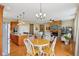 Open concept living area features an island kitchen and stone fireplace at 1361 Trescott Dr, Westfield, IN 46074
