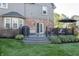 Outdoor deck features dining area and grill overlooking the manicured backyard at 13948 Silver Stream Dr, Carmel, IN 46032