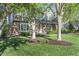 Beautiful two-story brick and siding home with lush lawn and mature trees at 13948 Silver Stream Dr, Carmel, IN 46032