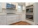Close-up of a modern kitchen featuring sleek stainless steel appliances and white cabinetry at 13948 Silver Stream Dr, Carmel, IN 46032