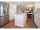 Kitchen featuring white cabinets, stainless steel refrigerator, and a center island at 13948 Silver Stream Dr, Carmel, IN 46032