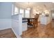 Breakfast nook flows to white kitchen with island, stainless steel appliances and ample storage at 13948 Silver Stream Dr, Carmel, IN 46032