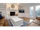 Cozy living room with fireplace, built-in shelves, and hardwood flooring at 13948 Silver Stream Dr, Carmel, IN 46032
