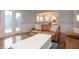Bright living room with hardwood floors, a leather couch, and french doors at 13948 Silver Stream Dr, Carmel, IN 46032