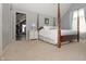 Main bedroom with four poster bed, ensuite and connecting gym at 13948 Silver Stream Dr, Carmel, IN 46032