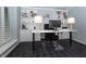 Contemporary home office with custom built-ins, modern desk, and comfortable chair at 13948 Silver Stream Dr, Carmel, IN 46032