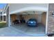 A well-lit two car garage, complete with a car and a brick exterior, ready for parking at 142 Winding Brook Way, Pendleton, IN 46064