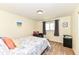 Simple bedroom with a queen size bed, carpet, and neutral decor at 143 Beechview Ln, Indianapolis, IN 46217