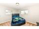Cozy bedroom features natural light from two windows and neutral walls at 143 Beechview Ln, Indianapolis, IN 46217