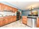 Stylish kitchen offering stainless steel appliances, granite countertops, and a cozy dining space at 143 Beechview Ln, Indianapolis, IN 46217