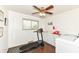 Bright laundry room equipped with modern washer and dryer, treadmill and ample storage at 143 Beechview Ln, Indianapolis, IN 46217