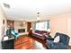 Cozy living room features hardwood floors, a brick fireplace, and comfortable seating at 143 Beechview Ln, Indianapolis, IN 46217