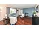Inviting living room boasts hardwood floors, large window, comfortable seating, and modern decor at 143 Beechview Ln, Indianapolis, IN 46217