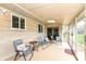 Covered patio offers comfortable seating and a relaxing outdoor space for entertaining at 143 Beechview Ln, Indianapolis, IN 46217