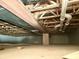 Unfinished basement featuring exposed ceiling beams, pipes, and concrete support, ideal for future customization at 14323 Chariots Whisper Dr, Carmel, IN 46074