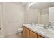 Bathroom with dual sinks, vanity, large mirror, and neutral color scheme for a calming space at 14323 Chariots Whisper Dr, Carmel, IN 46074