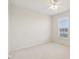 Bedroom showcasing a bright window, a ceiling fan, and neutral carpet for a comfortable space at 14323 Chariots Whisper Dr, Carmel, IN 46074