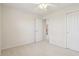 Bedroom featuring neutral walls and carpet, ceiling fan, and bright doorway for easy access at 14323 Chariots Whisper Dr, Carmel, IN 46074