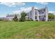 Well-maintained home with a spacious lawn and mature landscaping at 14323 Chariots Whisper Dr, Carmel, IN 46074