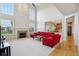 Bright living room featuring high ceilings, a fireplace, and an open layout at 14323 Chariots Whisper Dr, Carmel, IN 46074