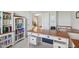 Well-appointed office with custom desk, ample shelving, and a bright, airy feel at 14323 Chariots Whisper Dr, Carmel, IN 46074