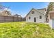 Backyard with privacy fence and green lawn at 15 N Campbell Ave, Indianapolis, IN 46219