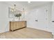 Bathroom featuring light hardwood floors, recessed lights, and double sinks with modern fixtures at 15 N Campbell Ave, Indianapolis, IN 46219