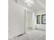 Bright bedroom featuring neutral carpet, walk-in closet and windows at 15 N Campbell Ave, Indianapolis, IN 46219