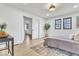Serene bedroom featuring hardwood floors, natural light, and a comfortable bed at 15 N Campbell Ave, Indianapolis, IN 46219