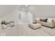 Bonus room featuring neutral carpeting, ample seating, and bright white walls at 15 N Campbell Ave, Indianapolis, IN 46219