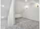 Bonus room features neutral carpeting, ample lighting, and versatile space for various activities at 15 N Campbell Ave, Indianapolis, IN 46219