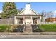 Charming home featuring a welcoming front porch and a well-maintained yard at 15 N Campbell Ave, Indianapolis, IN 46219
