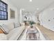 Bright living room featuring hardwood floors, recessed lighting, and an open concept at 15 N Campbell Ave, Indianapolis, IN 46219