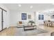 Bright living room featuring hardwood floors, neutral walls, and a stylish decor at 15 N Campbell Ave, Indianapolis, IN 46219