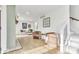 Inviting living room with cozy seating, hardwood floors, and staircase access at 15 N Campbell Ave, Indianapolis, IN 46219