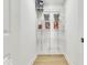 Walk-in pantry area featuring shelves, storage, and white door and trim at 15 N Campbell Ave, Indianapolis, IN 46219