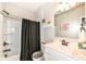 View of a bathroom with a shower and decorated vanity with wall art at 17066 Cole Evans Dr, Noblesville, IN 46060