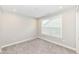 This bedroom has a window and neutral carpet flooring at 17066 Cole Evans Dr, Noblesville, IN 46060
