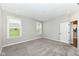 Bright bedroom with large windows and neutral walls, offering a peaceful retreat at 17066 Cole Evans Dr, Noblesville, IN 46060