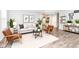 Stylish living room with modern decor, comfortable seating, and hardwood floors at 17066 Cole Evans Dr, Noblesville, IN 46060