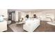 Bright and airy living room with hardwood floors, modern white kitchen, and stylish furniture at 20432 Atchison Way, Westfield, IN 46074