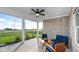 Covered patio featuring brick accents, comfortable seating, and an outdoor ceiling fan at 20432 Atchison Way, Westfield, IN 46074