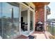 Outdoor balcony with patio furniture, grill and lake views, extending the living space outdoors at 20971 Shoreline Ct # 306, Noblesville, IN 46062