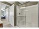 Bathroom showcasing a glass-enclosed shower and access to bedroom and closet areas at 20971 Shoreline Ct # 306, Noblesville, IN 46062