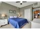 Inviting bedroom showcasing a comfortable bed, a window and an open door to the kitchen at 20971 Shoreline Ct # 306, Noblesville, IN 46062
